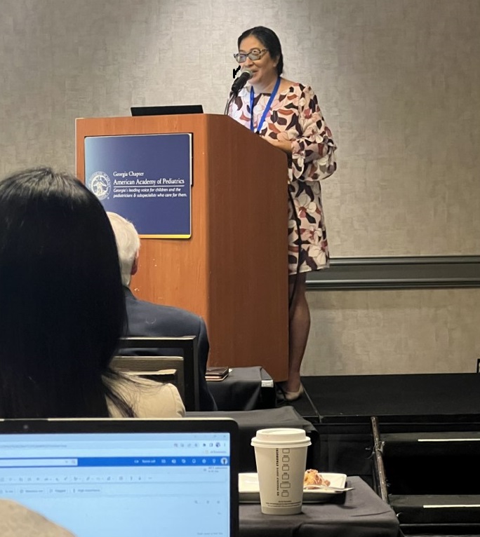 Speaker at Podium Speaker at Podium